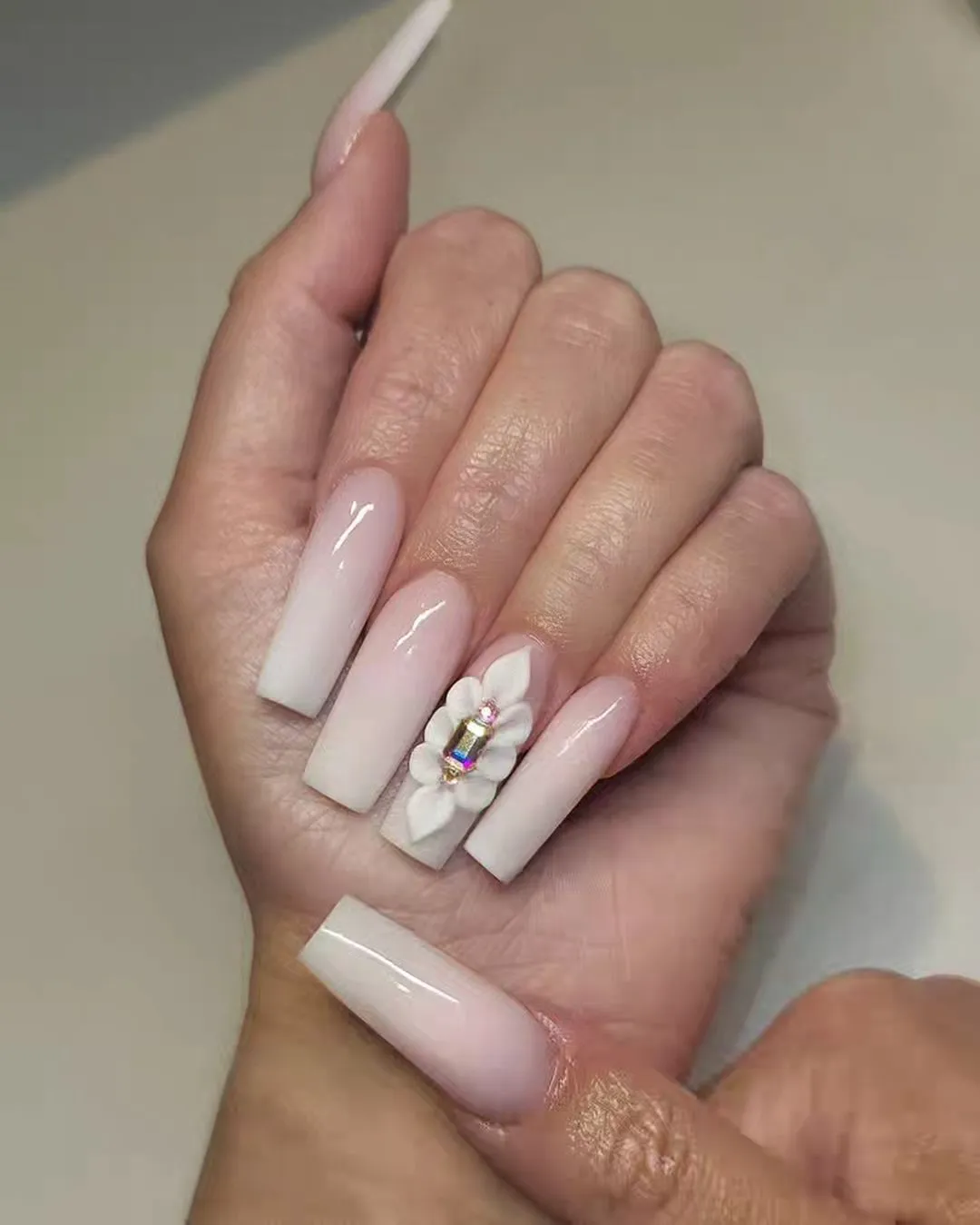 5. Pink and White nails with Floral Design