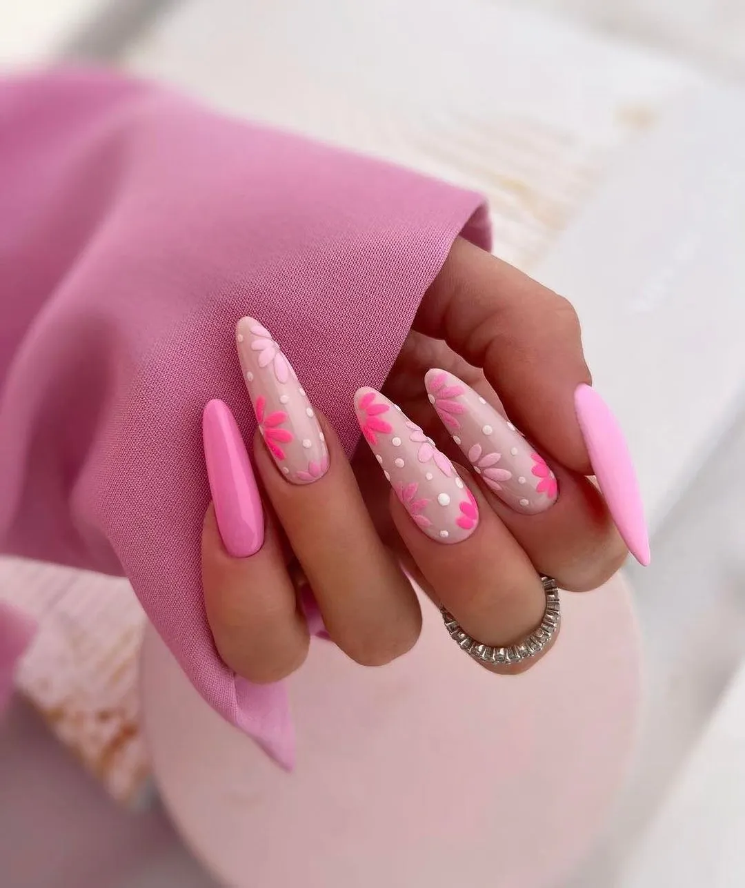 5. Pink nails idea with flower design