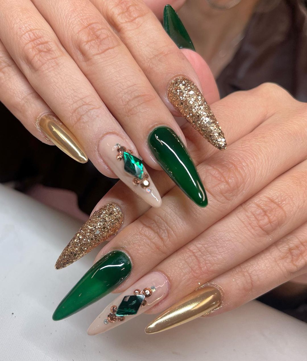 7. emerald green nails with gold spark