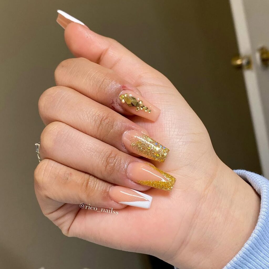 16. Golden Glittery Nails