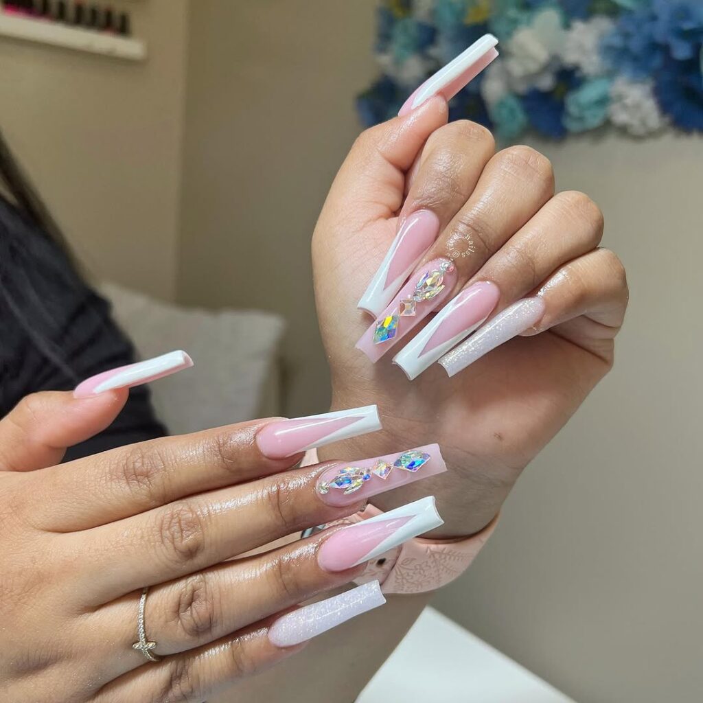 8. Long Pink and White Rhinestone Nails